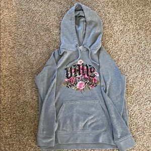 Hoodie with floral design,says “vans off the wall”